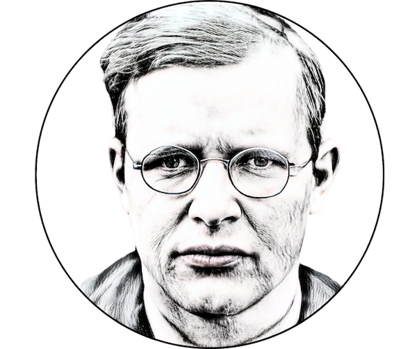 A black and white photograph of Dietrich Bonhoeffer, a man with short blond hair, staring tersely into the camera.
