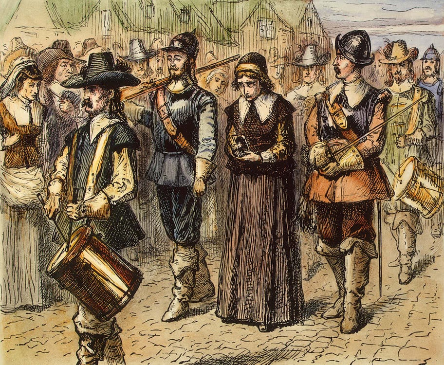 A color illustration of Mary Dyer being led down a Boston street to her place of execution. She is flanked by two armed men, with drummers in front and behind her. People stand and watch solemnly from the side of the road.